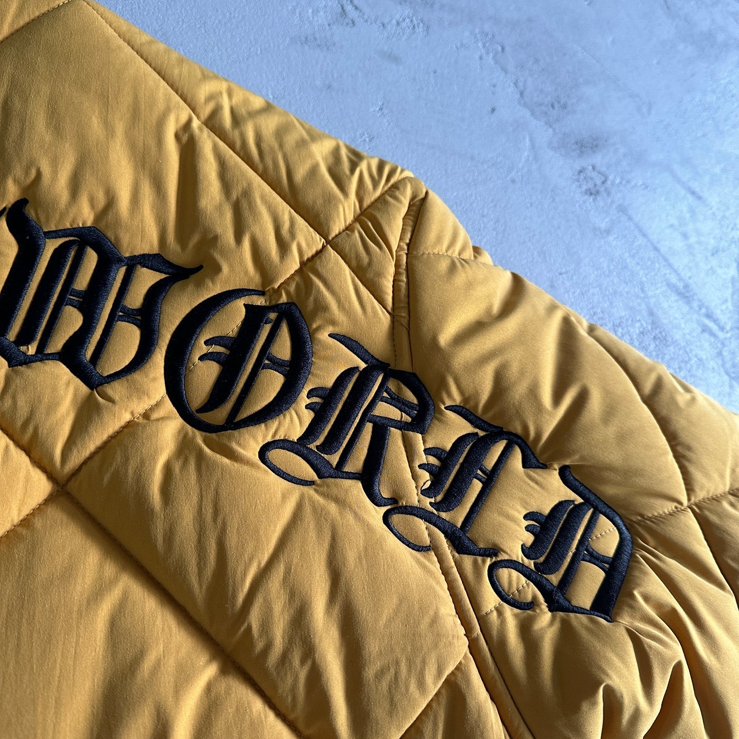 Corteiz Olde English Quilted Bomber Jacket